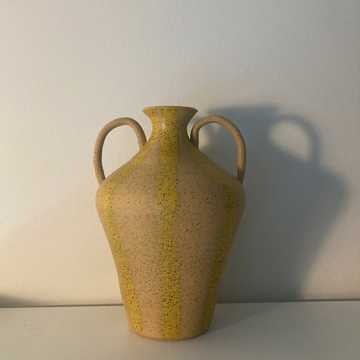 yellow striped vase