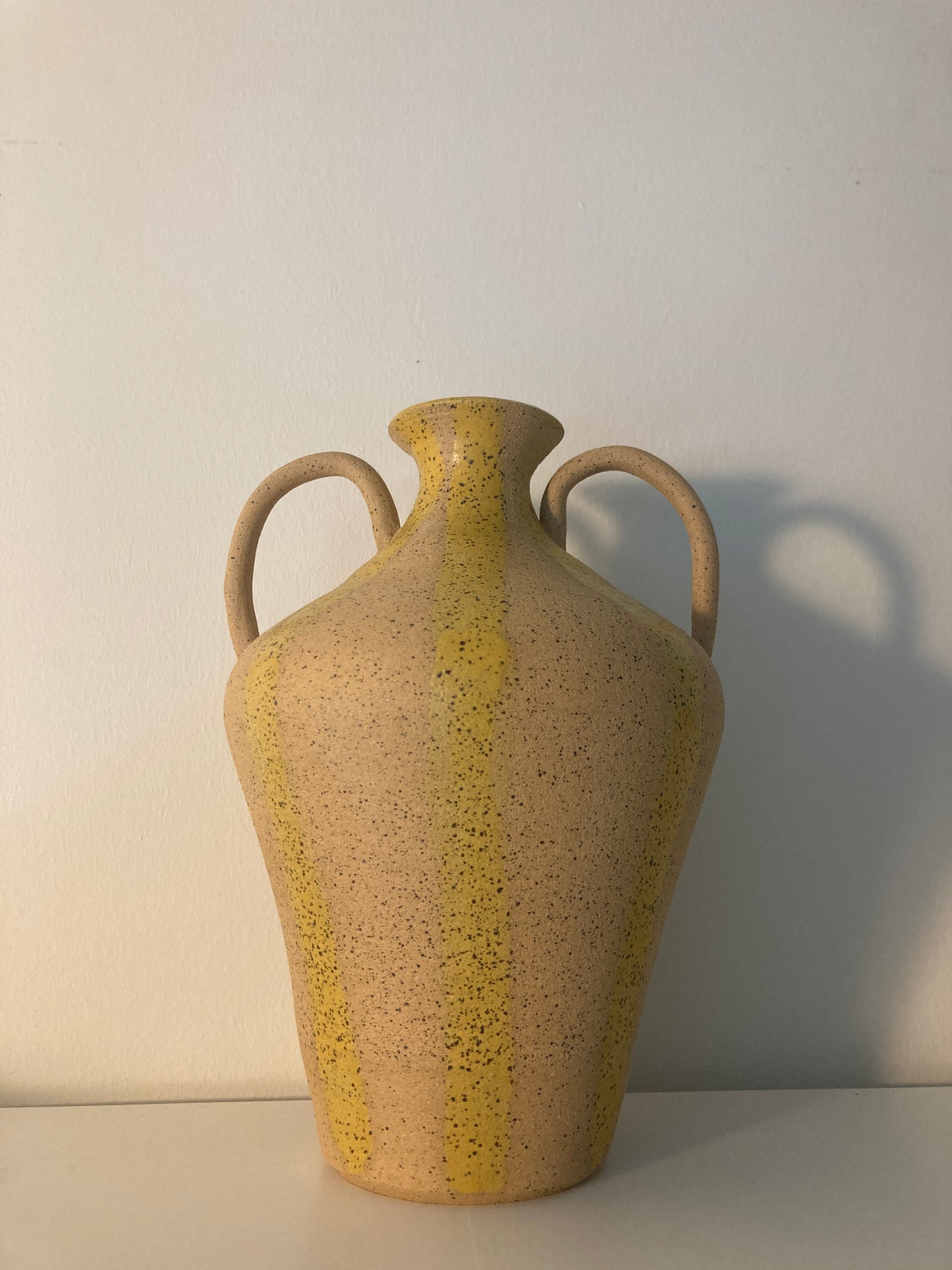 yellow striped vase